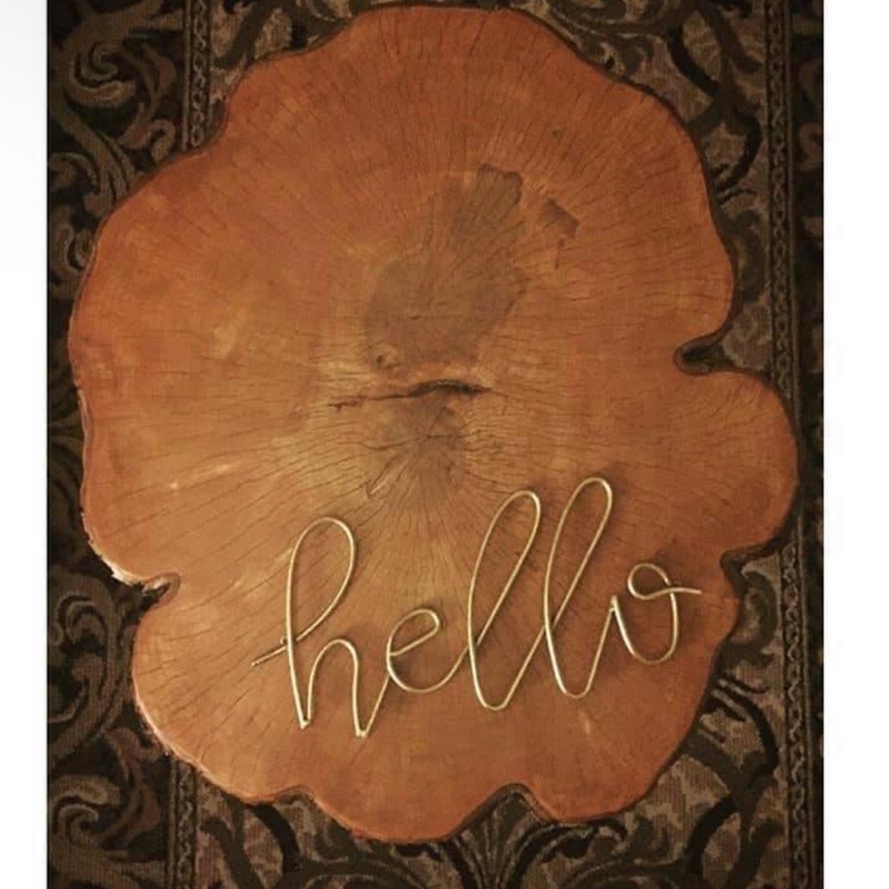 Hello brass wall sign